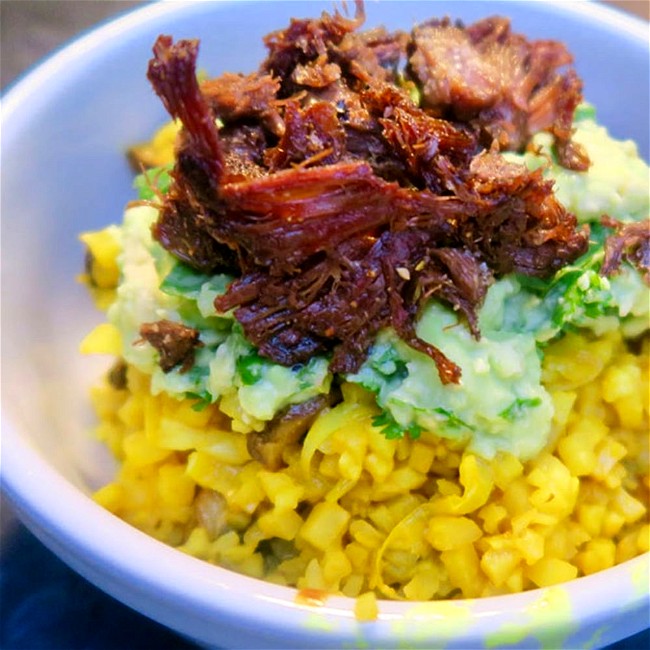Image of cauliflower rice, guac and crispy beef