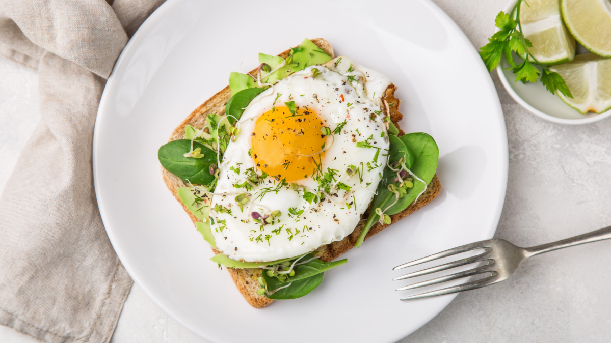 Image of Avocado Sourdough Toast with a Fried Egg and Herbs