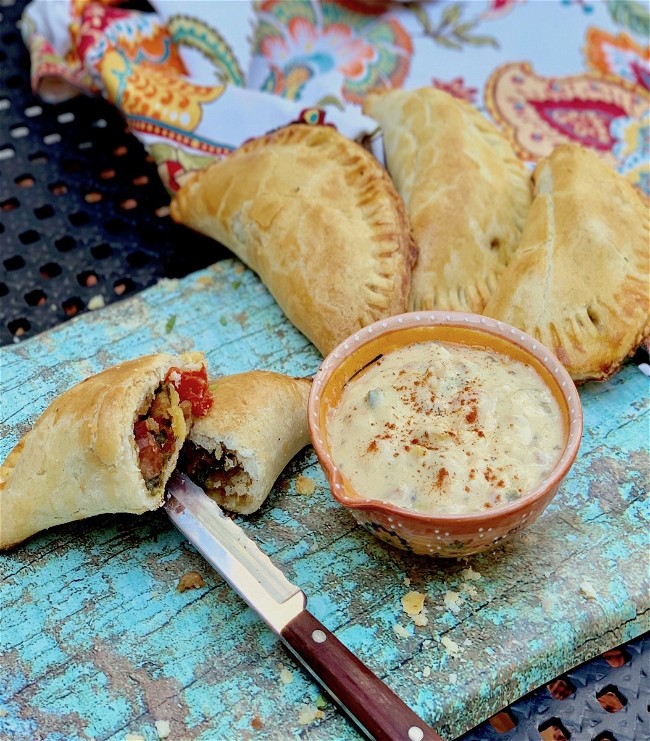 Image of Sausage, Peppers & Onion Empanadas with Pale Ale Beer Sauce