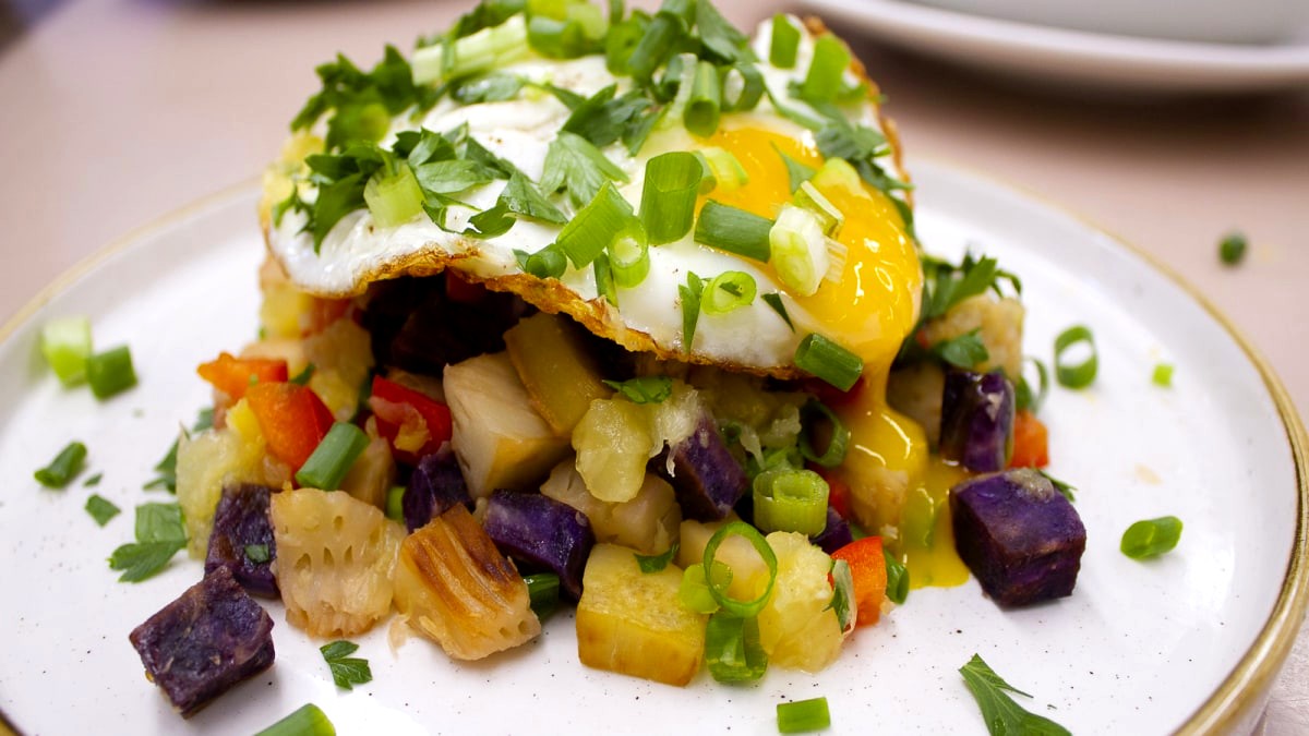 Image of ʻUlu & ʻuala hash with pineapple & egg