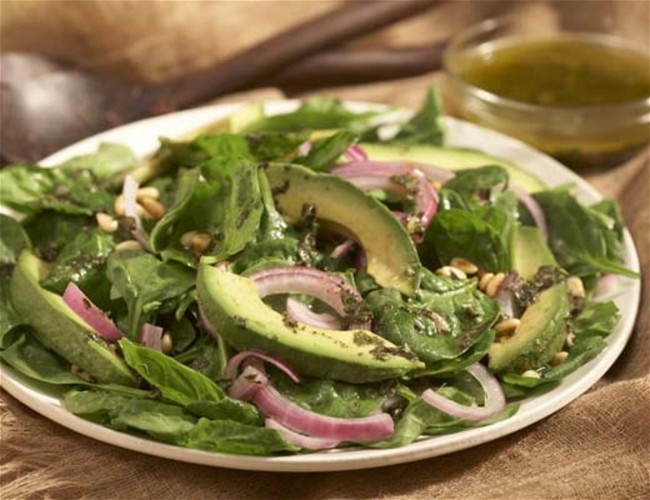 Image of Organic Spinach Salad with Basil Vinaigrette and Avocado Garnish