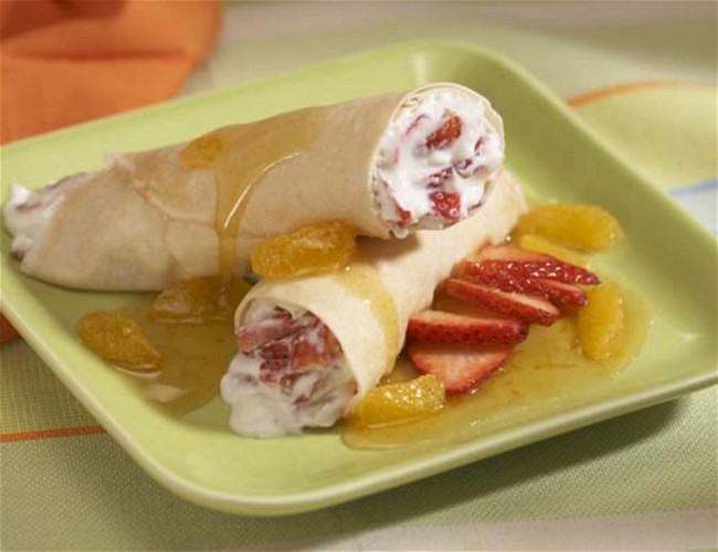 Image of Organic Strawberry Crepes with Pixie Tangerine Sauce