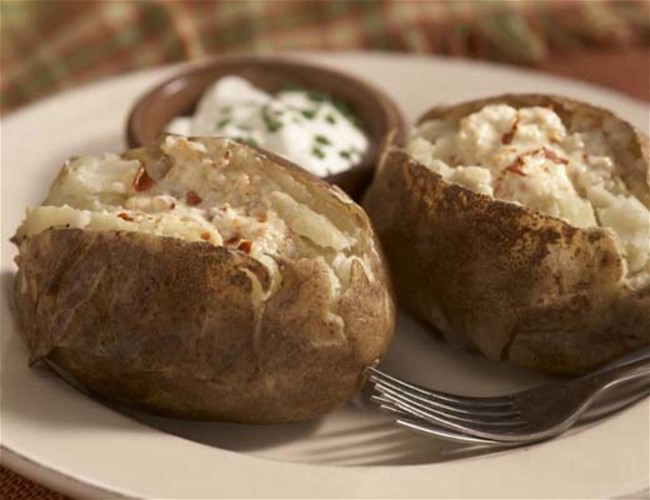 Image of Baked Potatoes with Pepper Flake Garlic Butter and Sour Cream