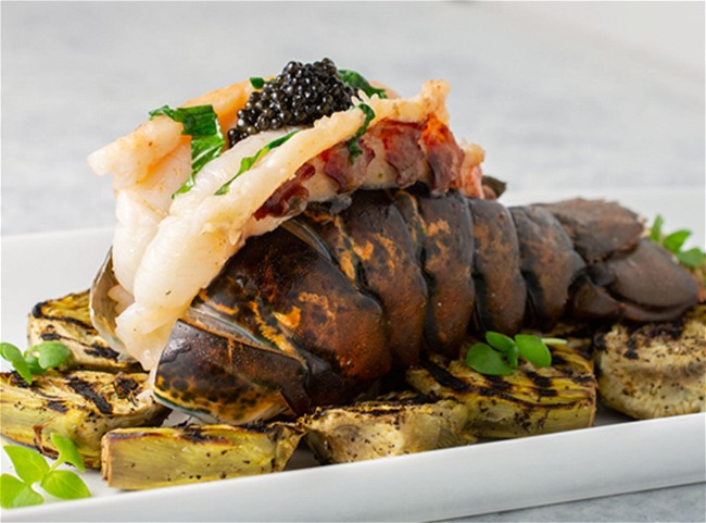 Image of Basil Butter Poached Lobster with Grilled Baby Purple Artichokes and Caviar