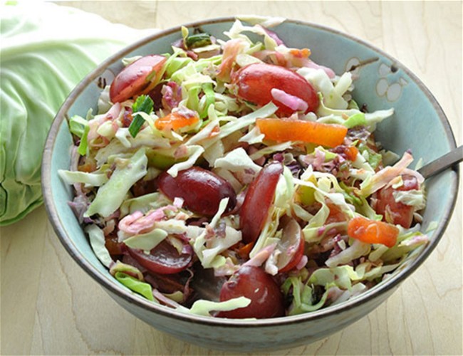 Image of Cabbage Slaw with Butterscotch™ Pears, Persimmon, Radish & Christmas Crunch® Grapes