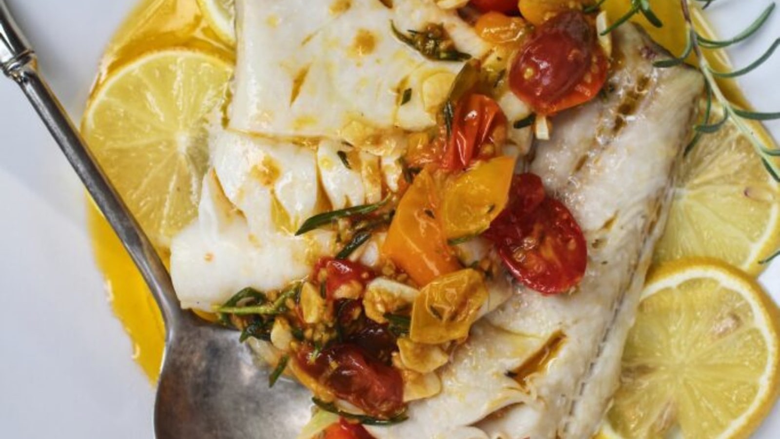 Image of Baked Alaskan Black Cod with Lemon-Rosemary Braised Tomatoes and Roasted Acorn Squash