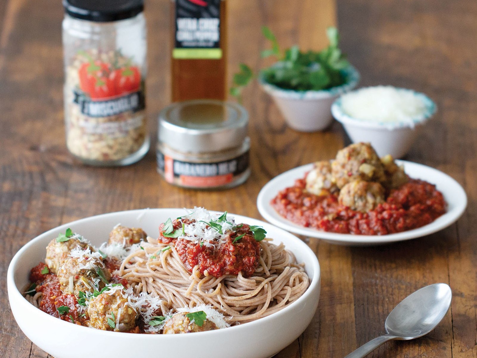 Italian dry pasta in the shape of pens in a glass bowl. Photograph