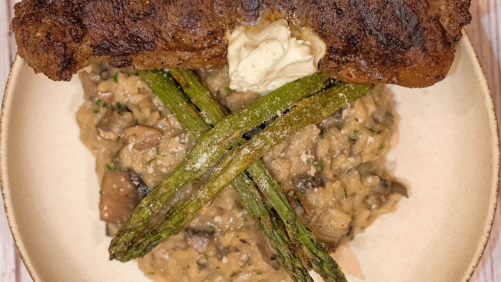 Image of Bison Strip Steak with Mushroom Risotto and Gorgonzola Cream Sauce