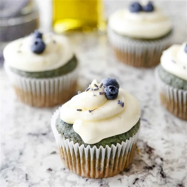 Image of Lemon Blueberry Olive Oil Cupcakes With Champagne Frosting
