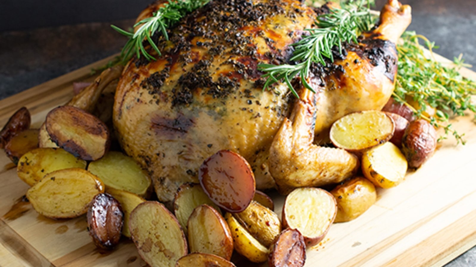 https://images.getrecipekit.com/v1612739779_Roasted_Chicken_and_Potatoes-1_sfpdnf.jpg?aspect_ratio=16:9&quality=90&