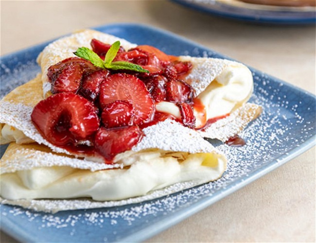 https://images.getrecipekit.com/v1616109217_Strawberry_Cream_Cheese_Crepes_sehycn.jpg?width=650&quality=90&