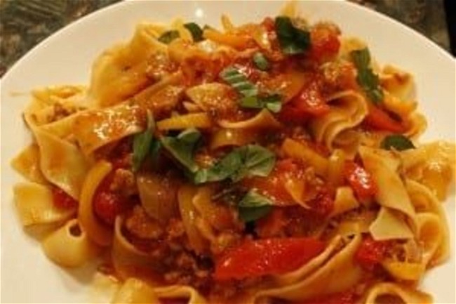 Image of Spicy Italian Sausage, Carmelized Onion and Red & Yellow Peppers with Fresh Basil
