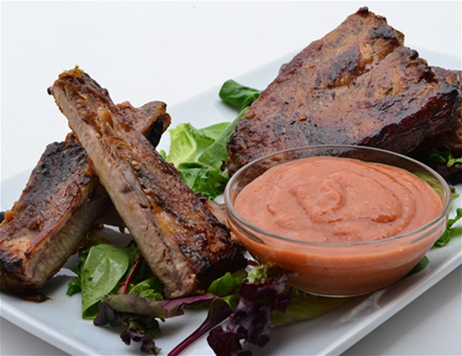 Image of Grilled Rack of Ribs with Cactus Pear Mango BBQ Sauce