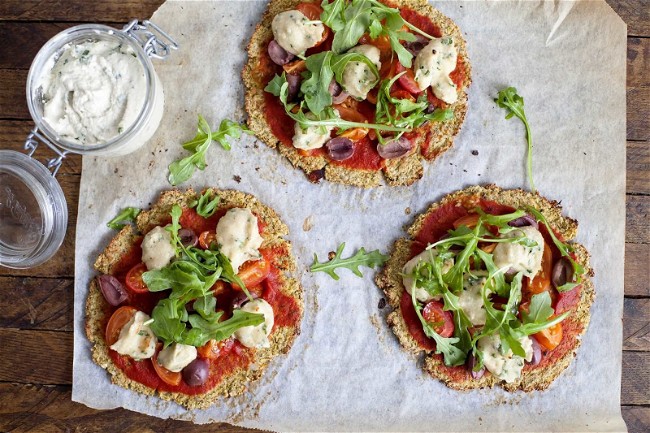 Image of Cauliflower Pizza with Cashew ricotta, Olives and Arugula