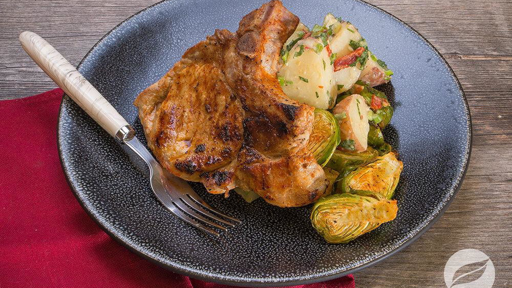 Image of Rodeo Pork Chops with Roasted Brussels Sprouts & Potato Salad