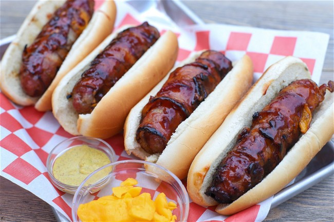 Image of Cheese Curd Stuffed Bacon-Wrapped Brats